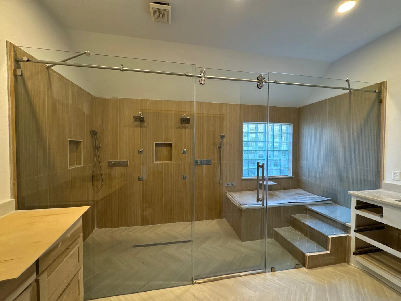 A dated Houston bathroom replaced with a tiled walk-in shower after the remodel