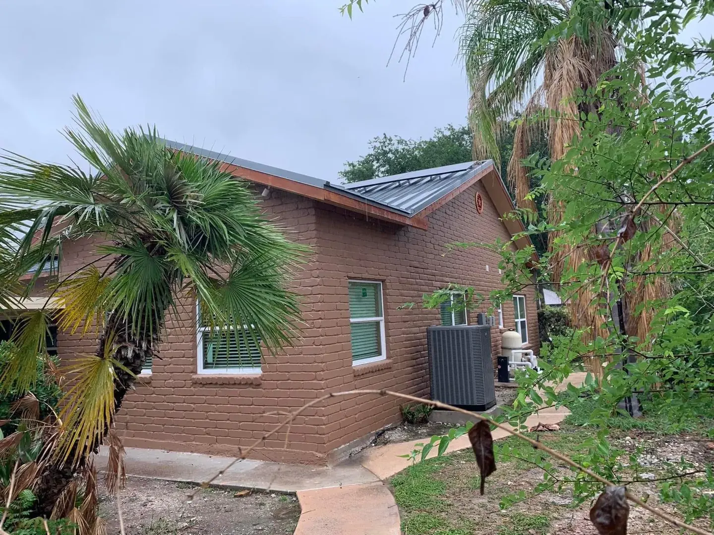Painted and brick house exterior in the Houston area by LL General Contractor
